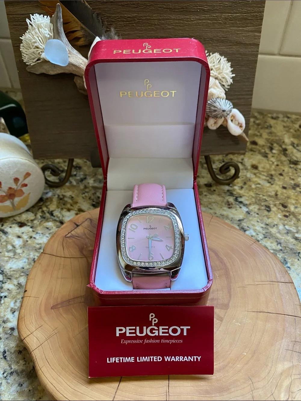 Peugeot oversized pink watch with rhinestones bezel. New in box.